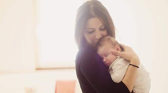 mum kissing her baby