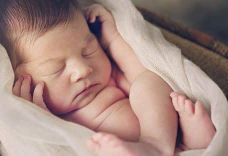 baby sleeping with blanket