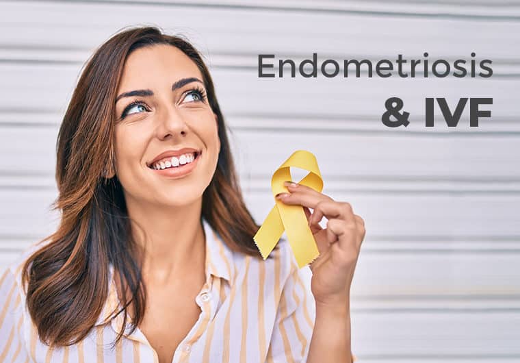 Endometriosis and IVF Woman holding yellow ribbon looking away from camera smiling