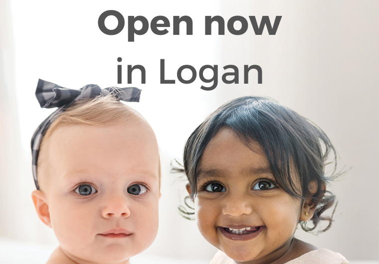 Hello Logan: Low-cost IVF now in a new location white baby and brown baby smiling into camera