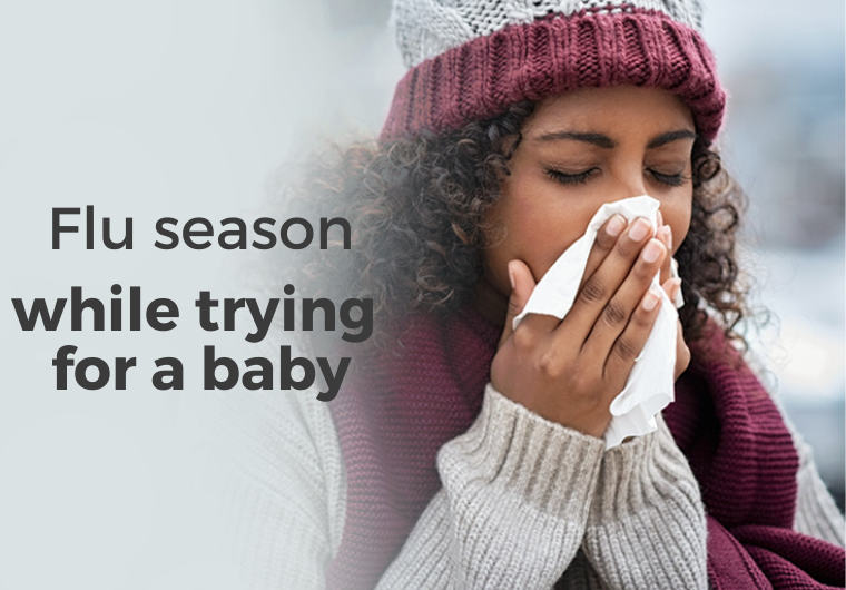 Flue season while trying for a baby woman sneezing into tissue